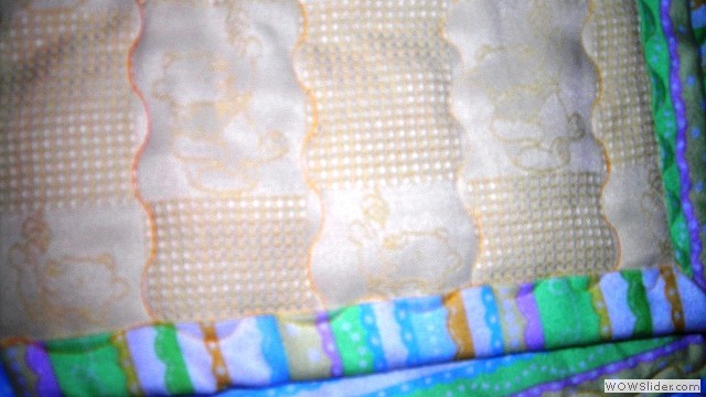 Winnie the Pooh and friends yellow blanket close up corner and front view